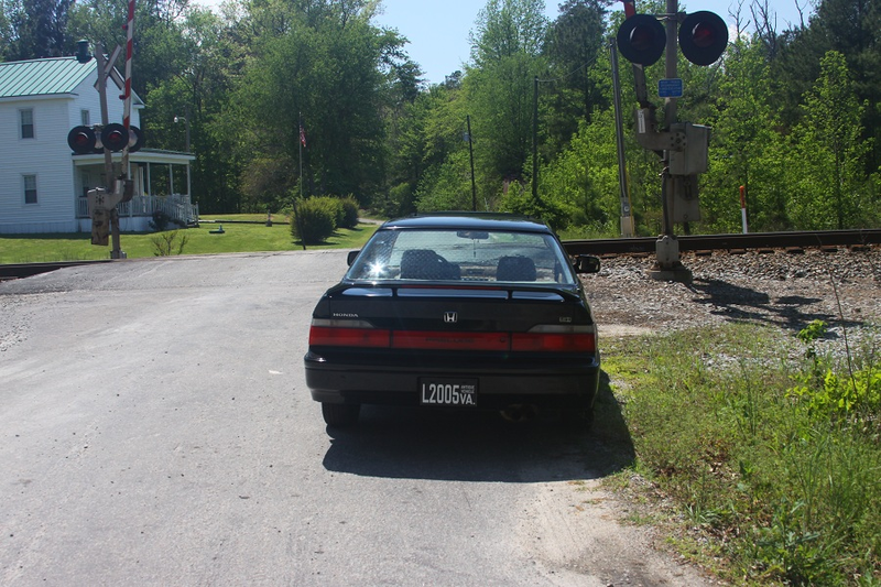 Quiet back road railroad crossing.